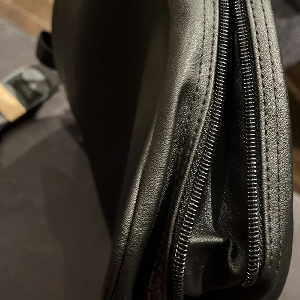 Briefcase, Black, Handles and Shoulder Straps lots of storage.